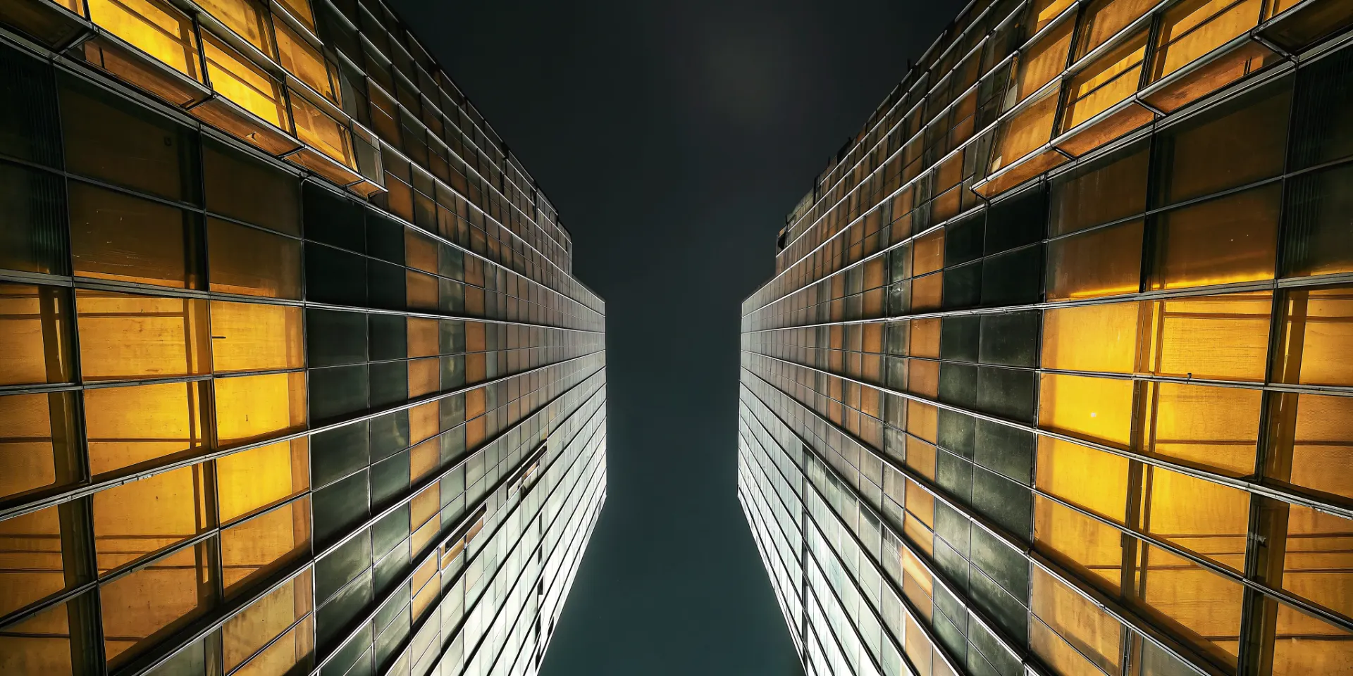 Glass towers lit at night